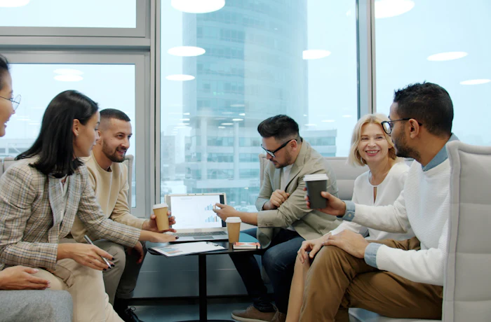 Diverse team of professionals meeting together in a modern office